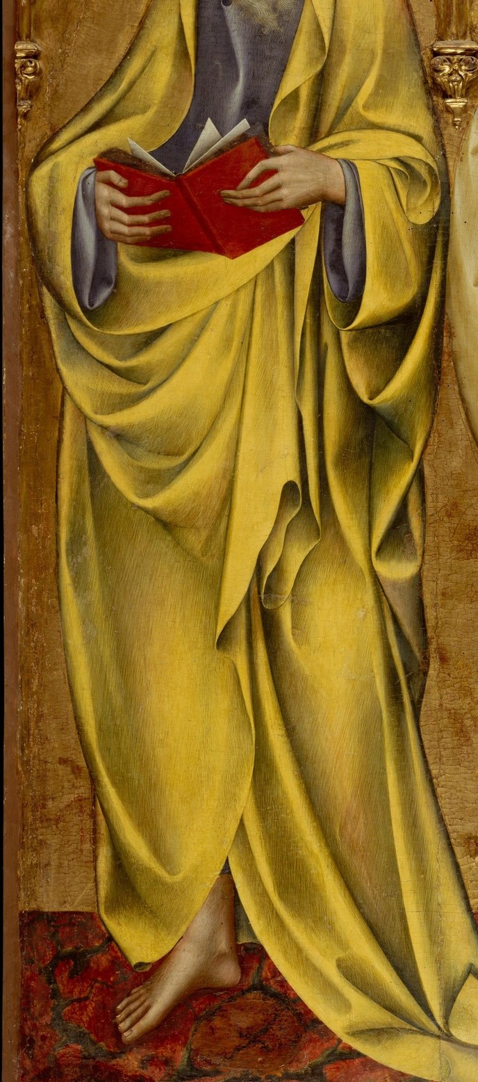 Saint Matthew, on the left, wears the yellow robe of an evangelist.