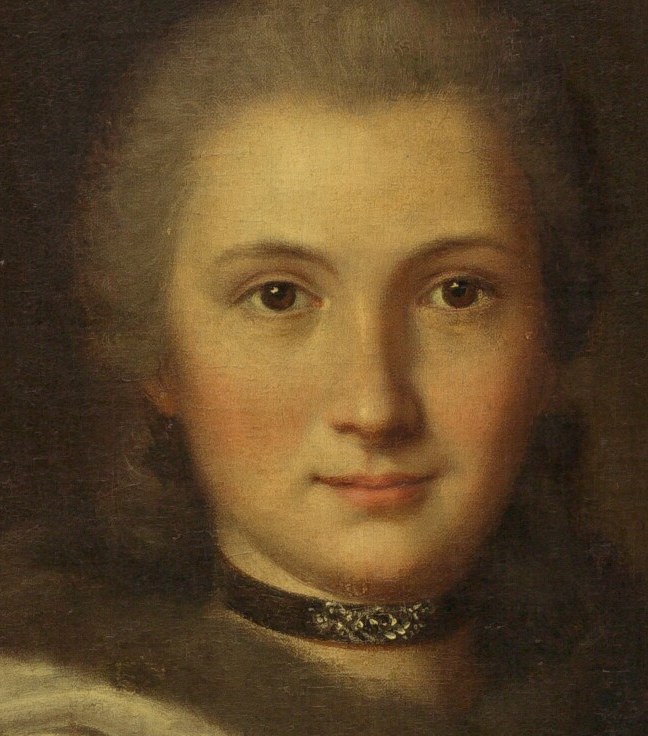 Her face is almost perfectly illuminated.