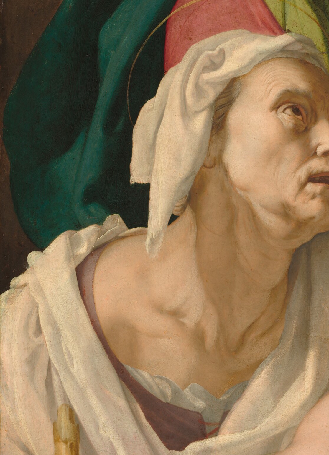 He paints the Holy Family, but he gives the oldest face in the room his full attention.