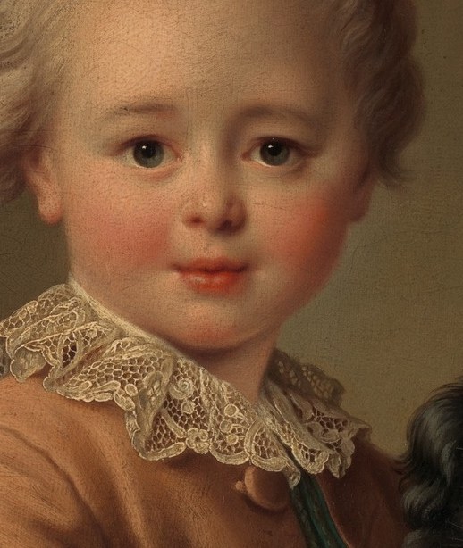 This young boy seems to gaze right at us.