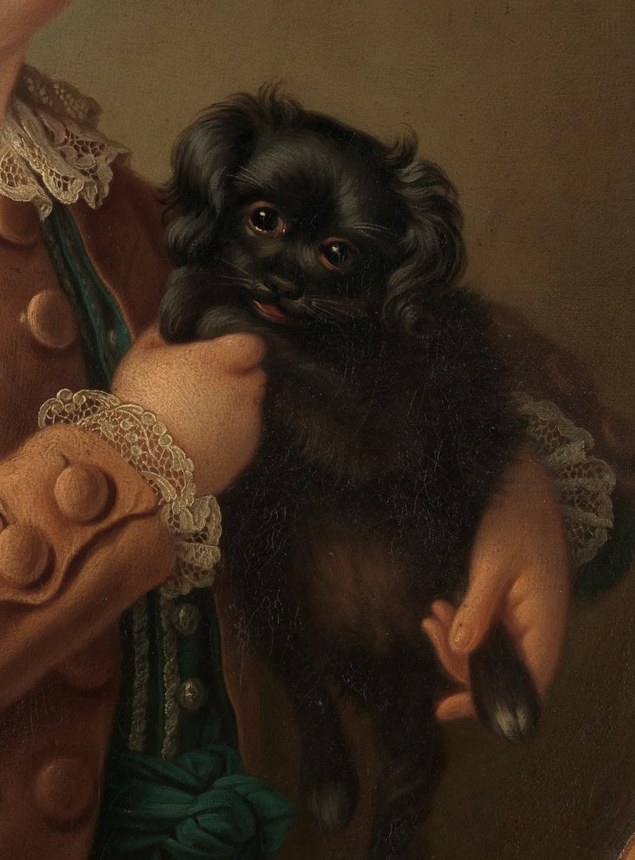 Its dark fur and alert posture provide a visual contrast to the boy and symbolize loyalty and companionship.