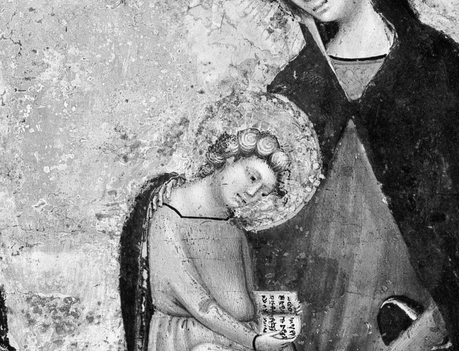 Her son is impossibly small, pressed tight to her chest.