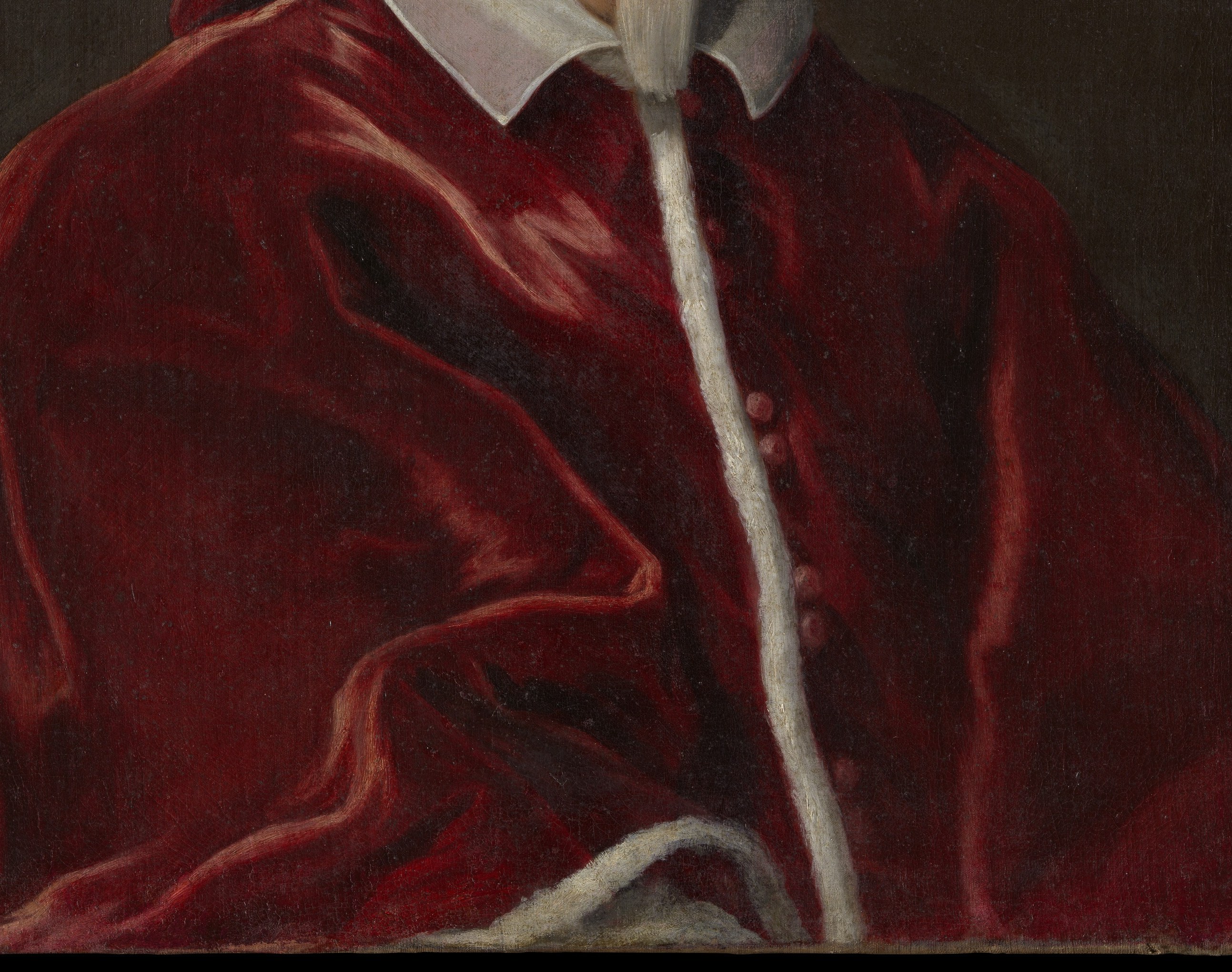Look at the rich red velvet of his robe.