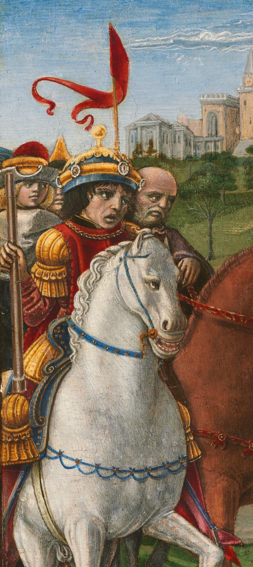 A guarded procession moves through the street.