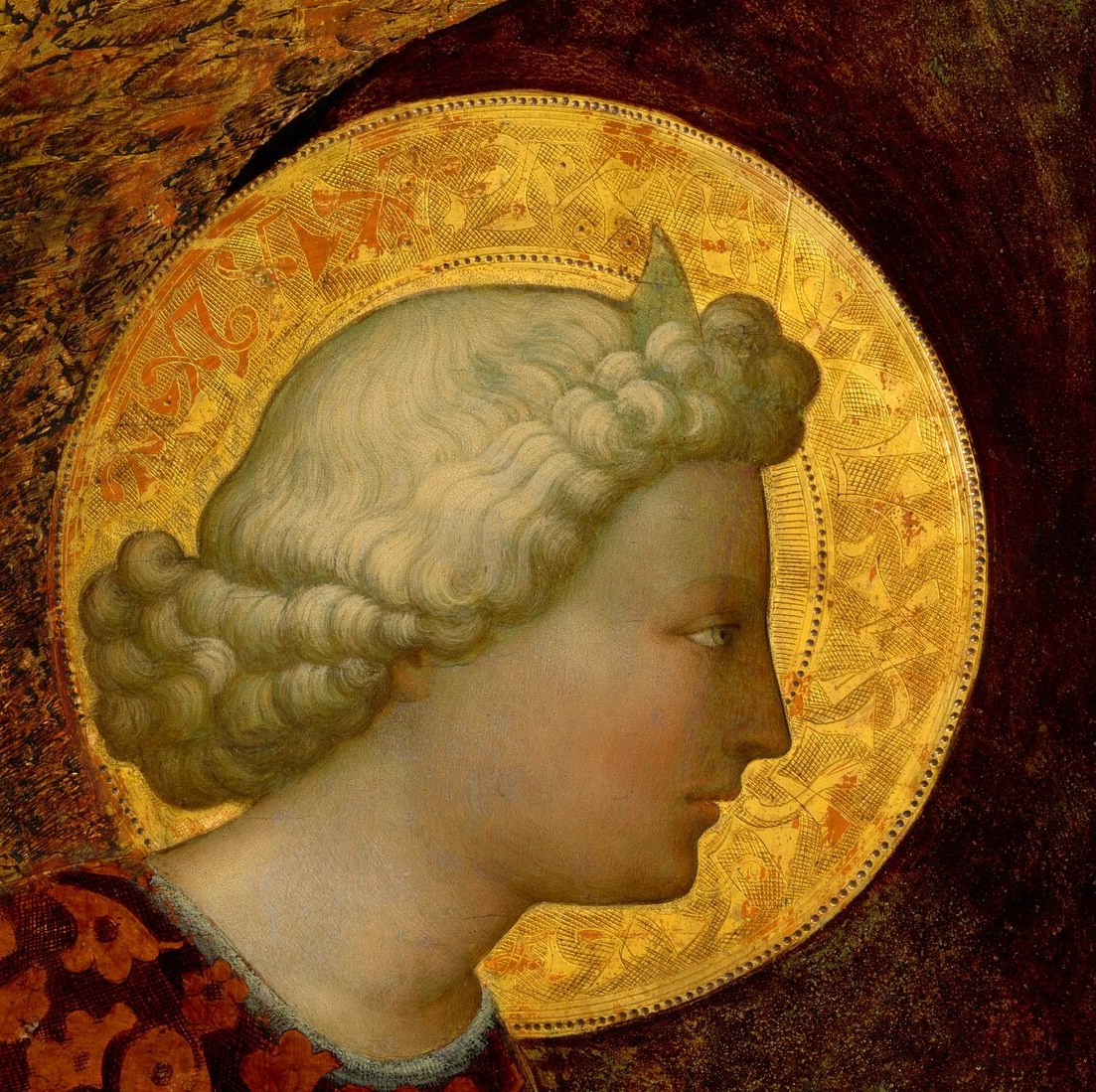 The halo signifies divinity and holiness, a classic symbol of sacred figures.