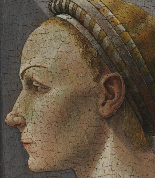 Her sharp profile shows a pose common in early portraiture.