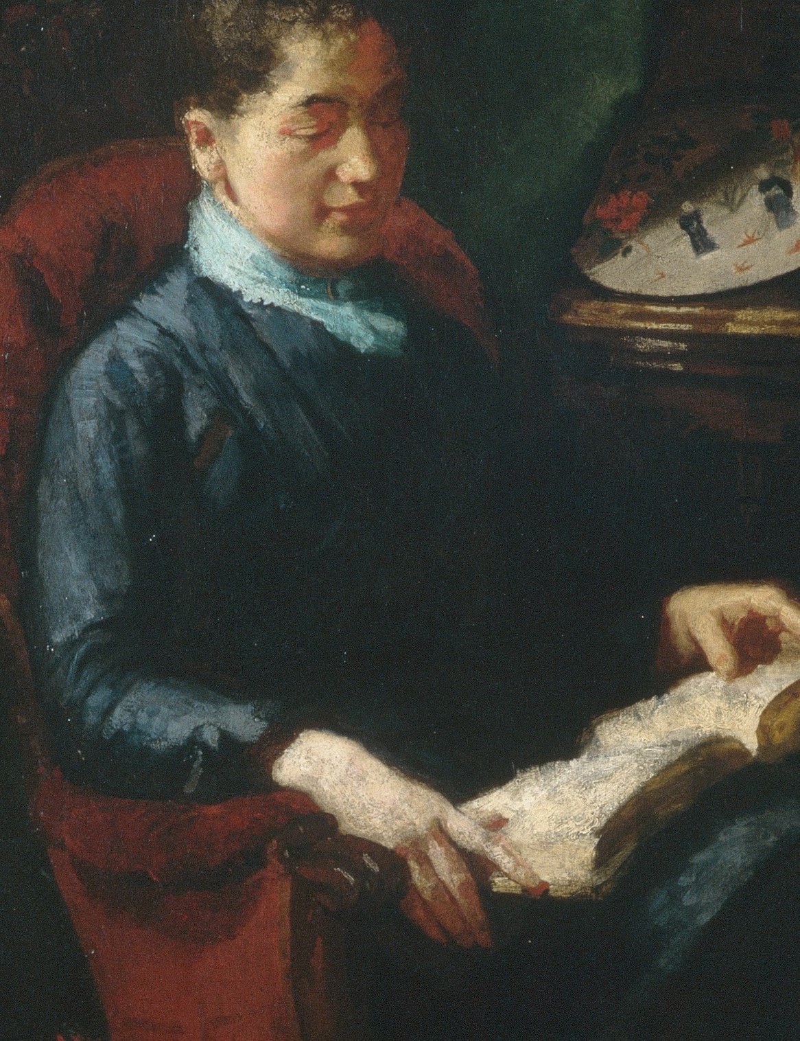 The saturated cobalt is the dominant chromatic note in an otherwise tonal composition; its flatness contrasts with the luminous book pages, directing the eye