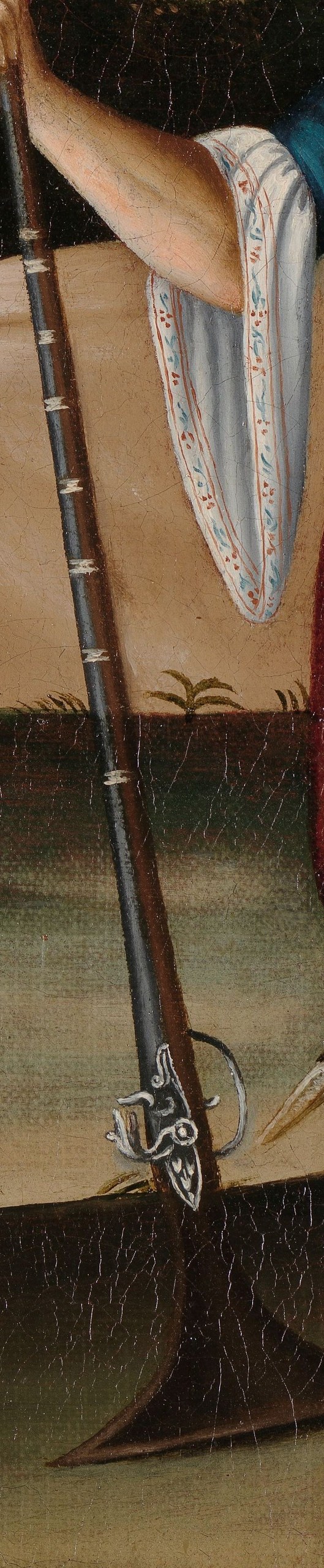 His long rifle and sword mark him as a warrior.