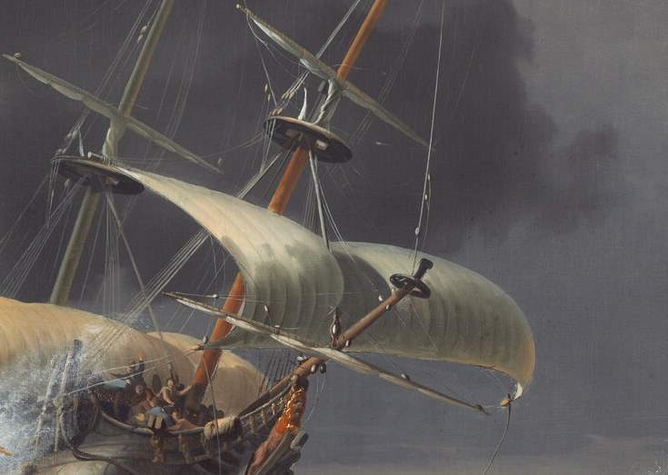 Its torn sail shows the brutal force of the wind.