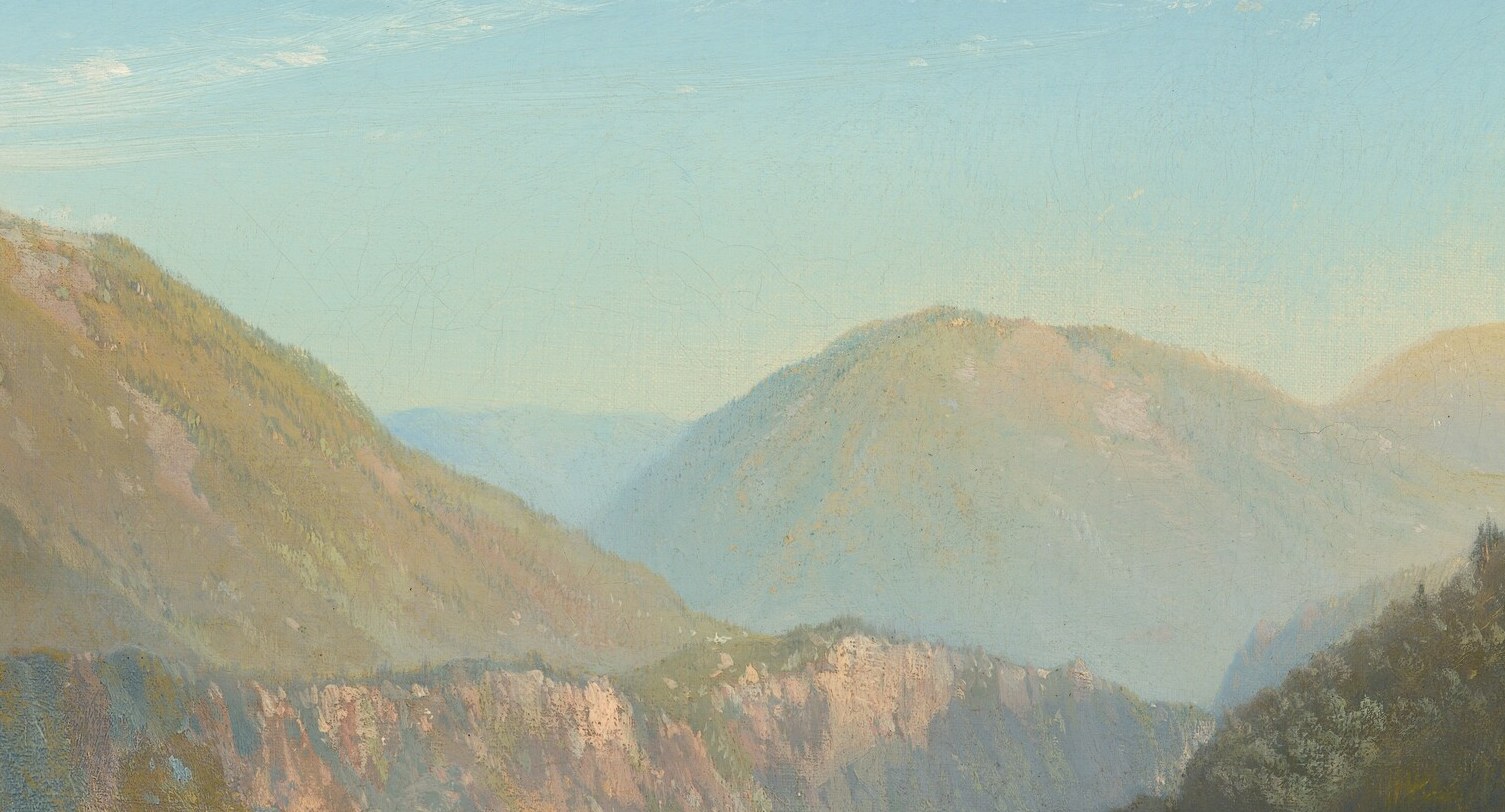 His light pools exactly where the mountain walls part.
