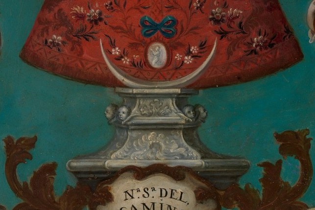 Below her pedestal, a painted inscription names the patrons.