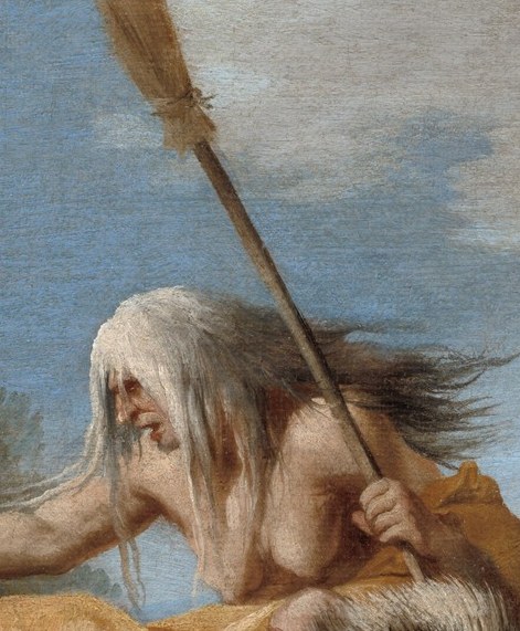 She brandishes a broom over the grim results of her magic.