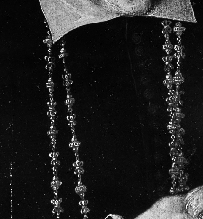 Look at what hangs around his neck.