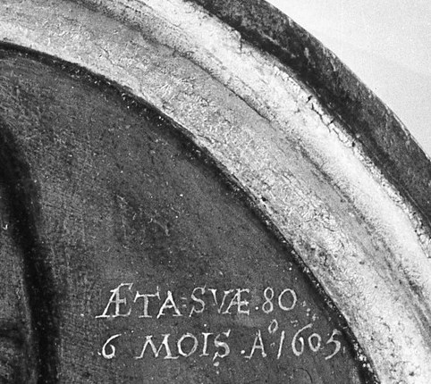 The inscription beside him reads: 1605.