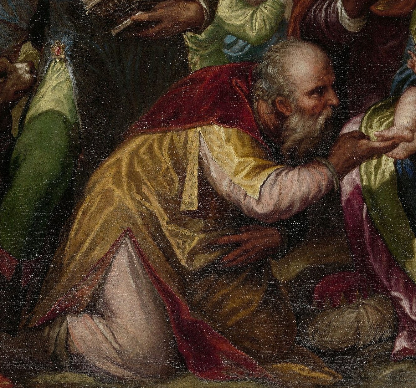 The kneeling king offers gold, a symbol of Christ's royalty.