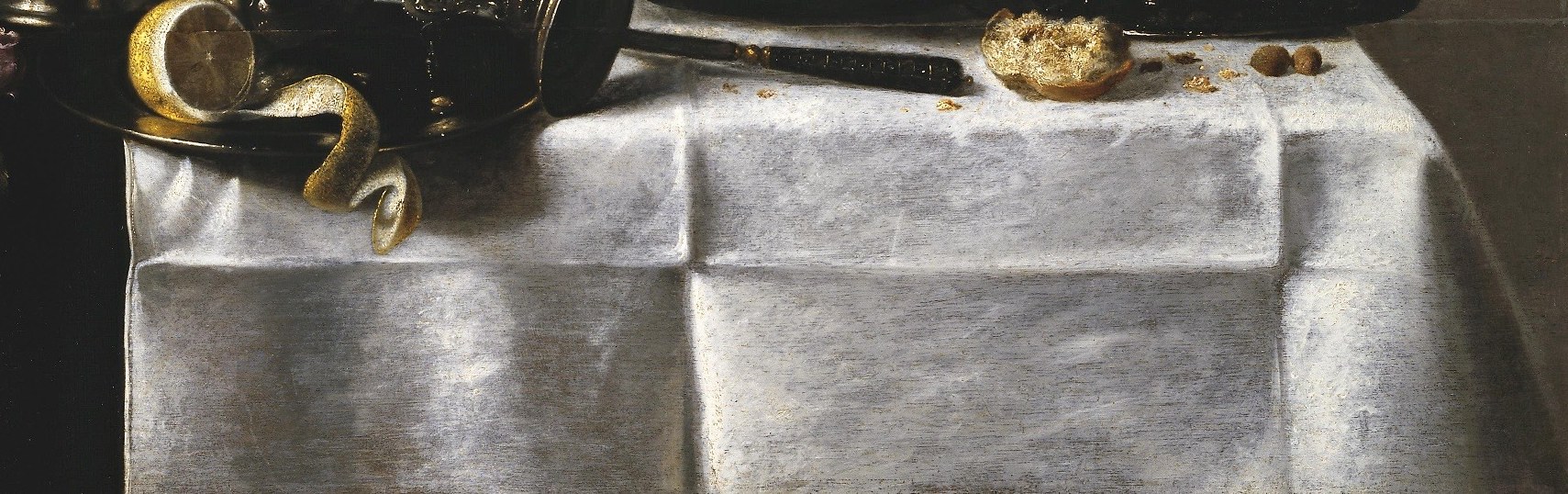 Each fold of the white tablecloth feels real to the touch.
