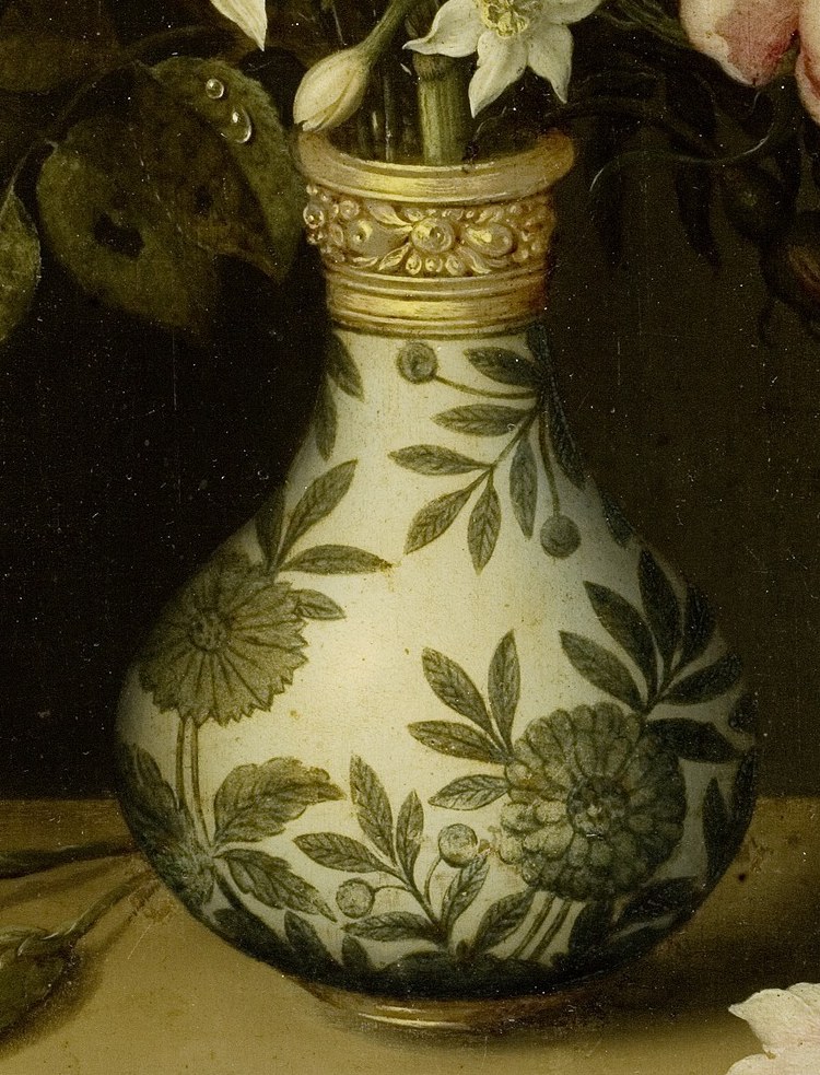 The intricate floral pattern and gilded rim highlight the value and exoticism of the object, a symbol of wealth and trade.