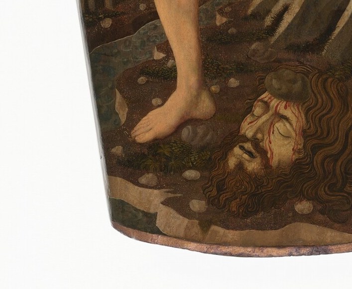 Narrative climax delivered at the viewer's feet , the giant's scale and defeated expression punctuate the moral victory; compositionally hidden until the eye travels down