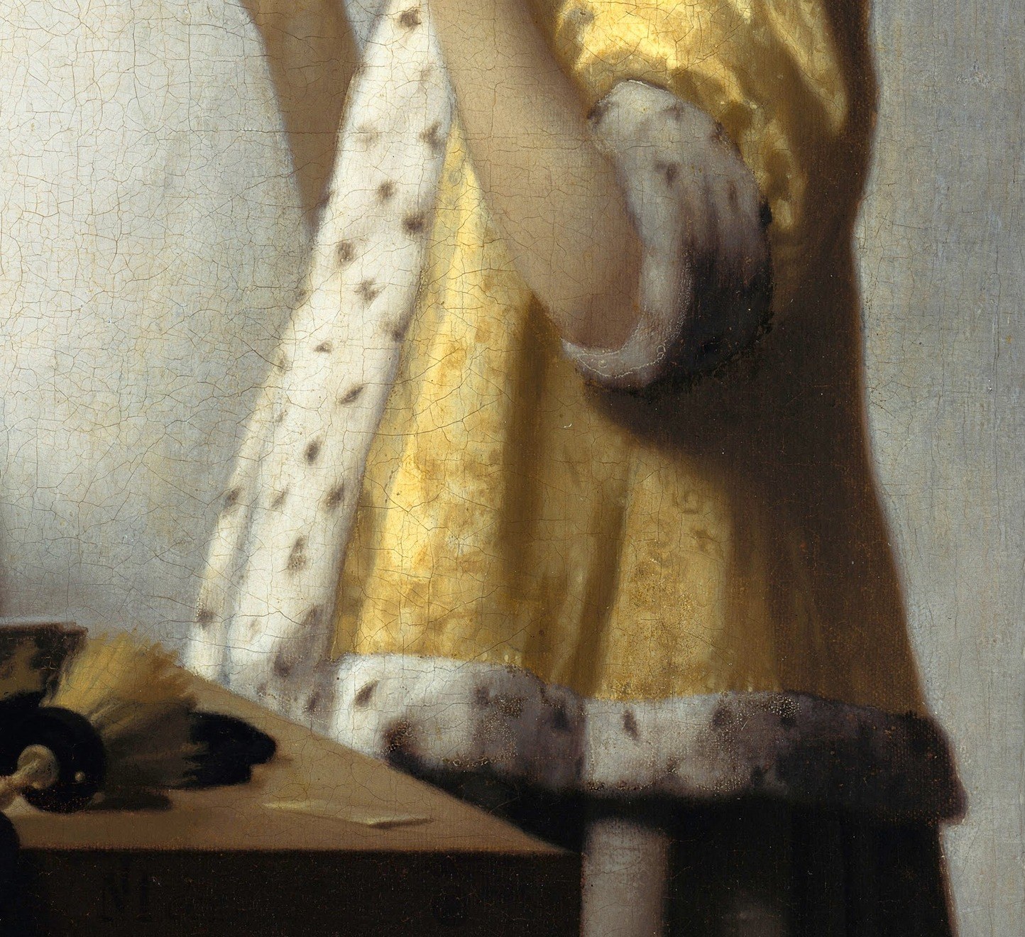 The luxurious fabric and trim indicate her upper-class status and the richness of the domestic setting.