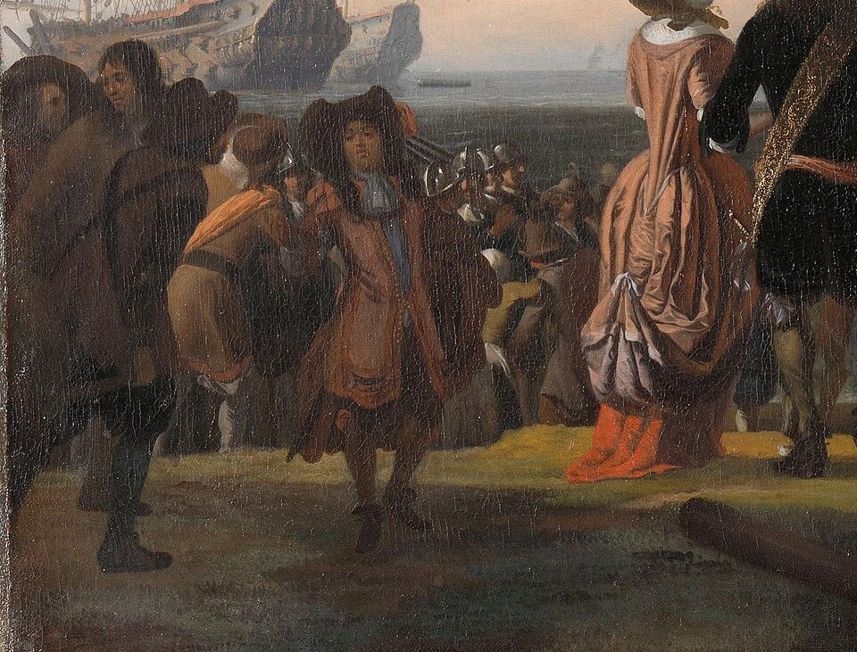 On shore, people gather to watch the ships.