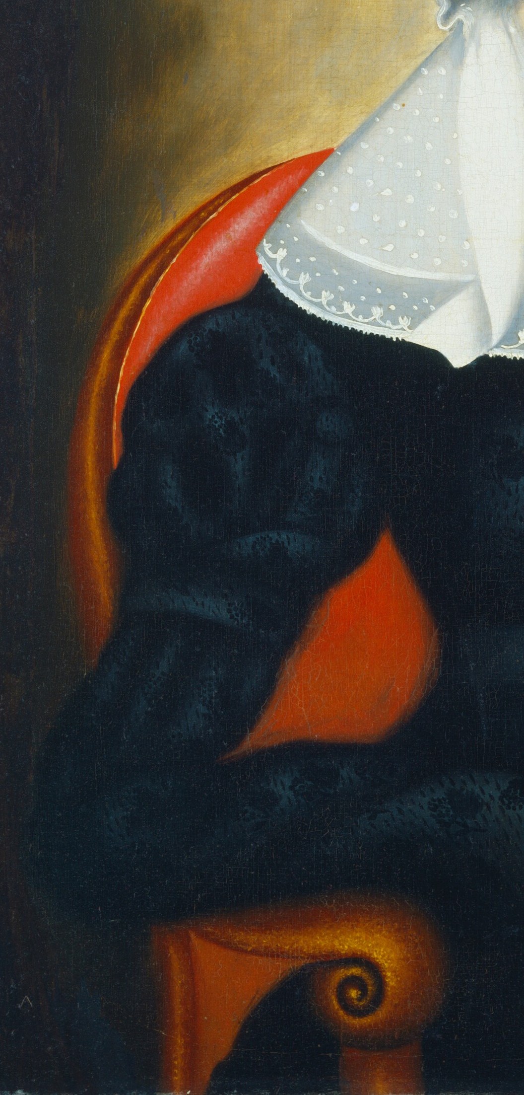 And the armrest of her chair, a vibrant crimson.