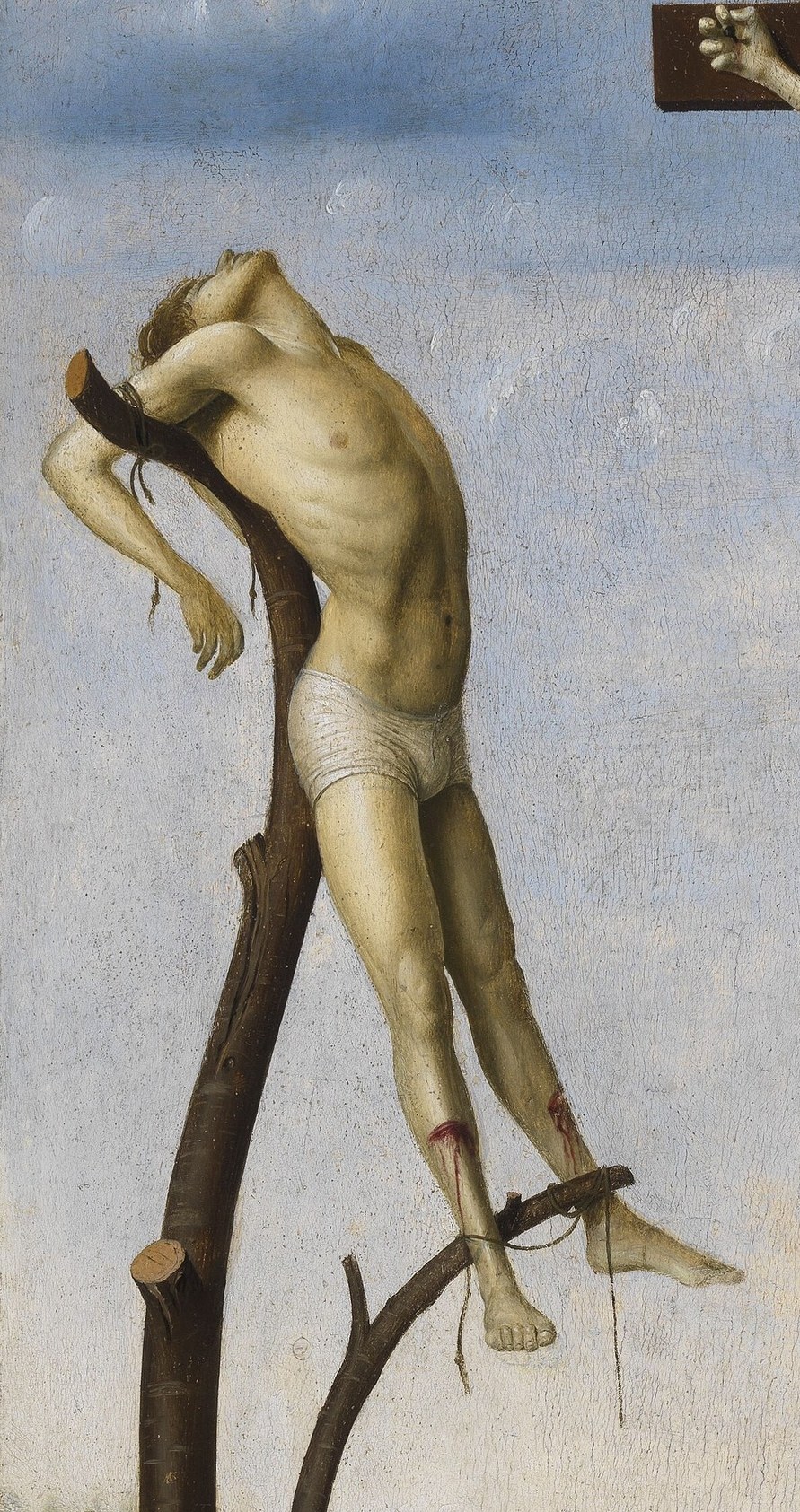 His contorted body and strained expression convey agony and despair.