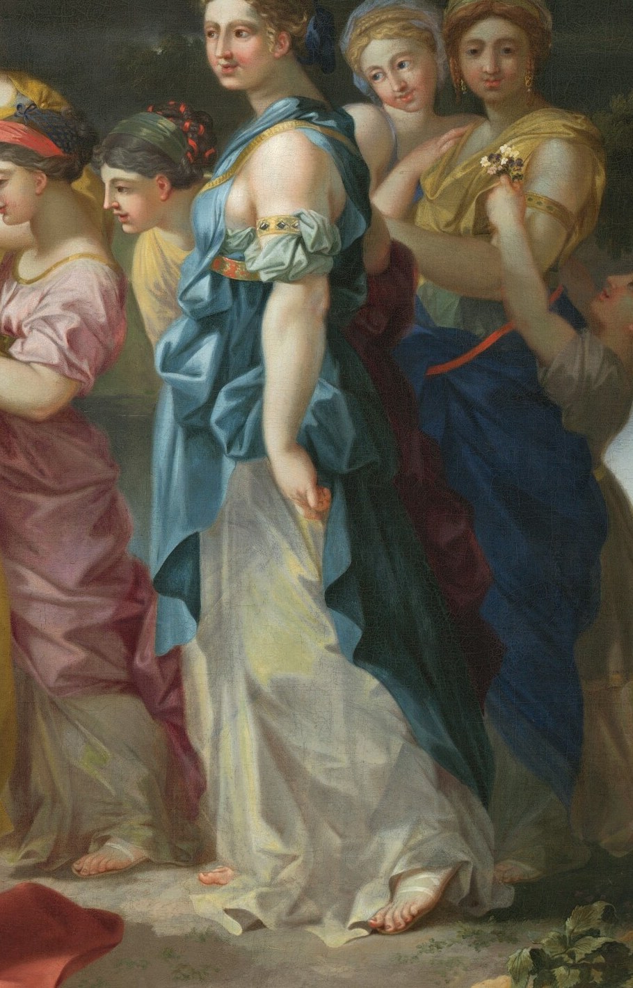 Her attentive expression and position suggest curiosity and participation in the unfolding event.