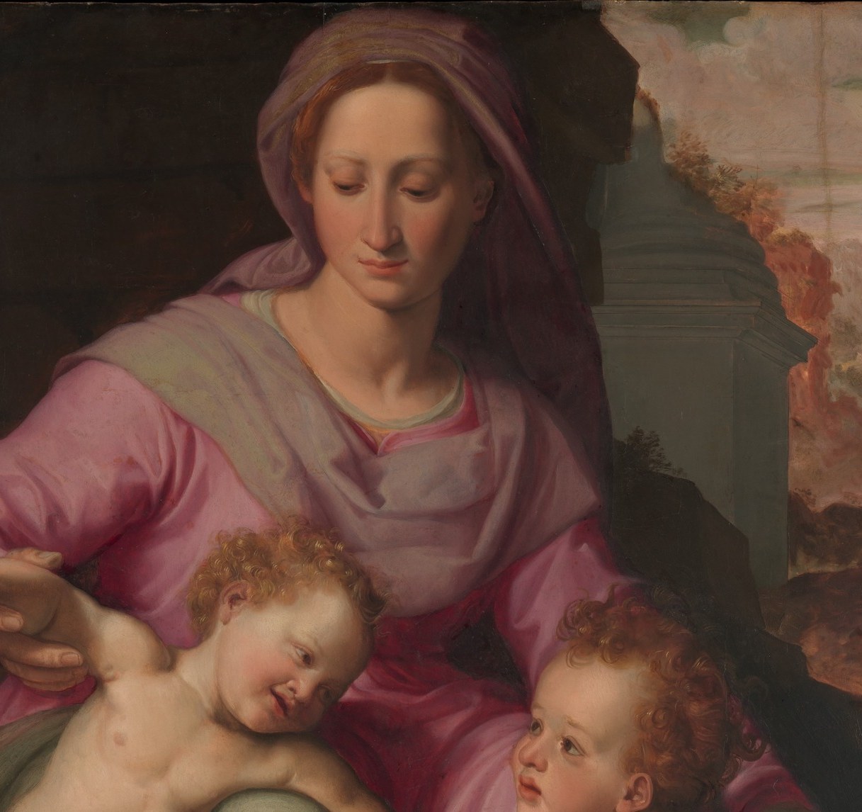 The dominant warm color mass; the specific rose-pink is a Counter-Reformation Florentine palette choice , readable as compassion rather than the medieval Virgin's blue.