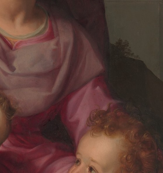 Slightly older and more alert than Christ; his gaze directed toward the lamb identifies him as the herald pointing to the Agnus Dei.
