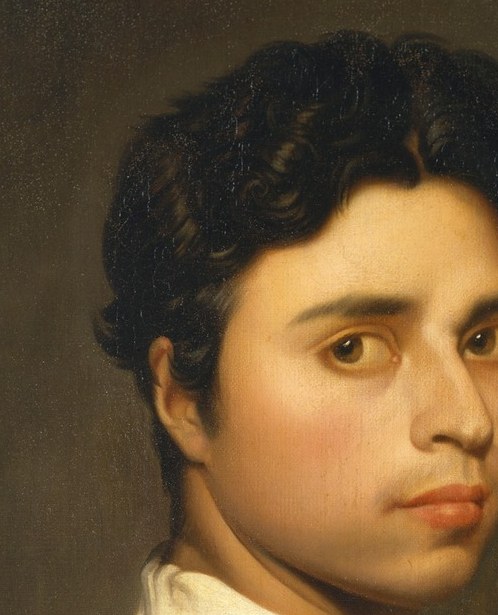 The raking light across his cheekbone is Ingres's own signature technique.