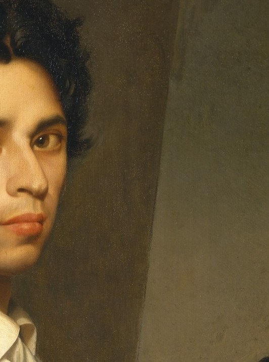 The white cloth in his hand: the artist wiping his brush, caught mid-work.