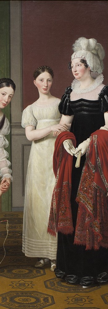 Her black dress amid a sea of white and pastel reads as the elder generation , possibly the grandmother; the color contrast carries generational and possibly mourning weight.