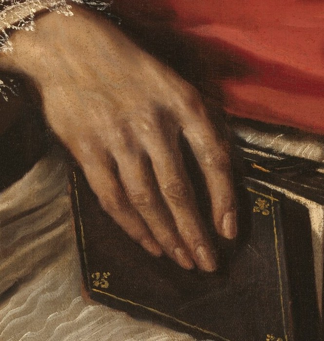 The delicate folds of his left hand hold a small book.