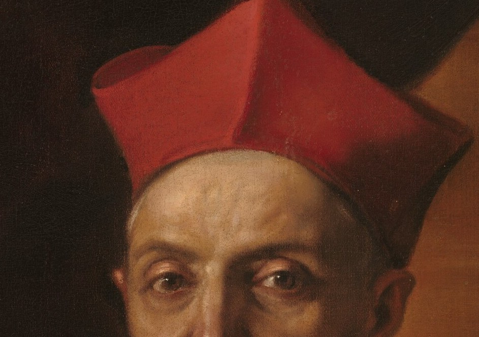 The vibrant red cap is a clear symbol of his ecclesiastical rank and authority.