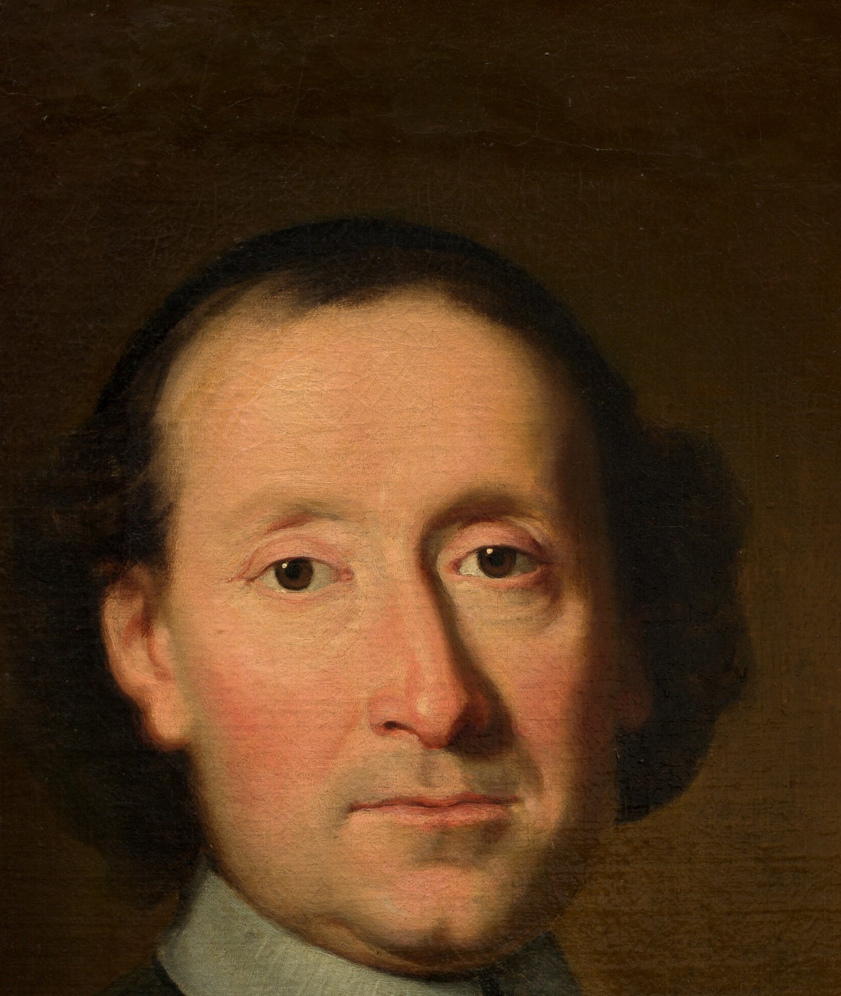 The entire psychological weight of the portrait resides here , a composed, slightly asymmetric face that rewards long looking for traces of character behind the formal pose.