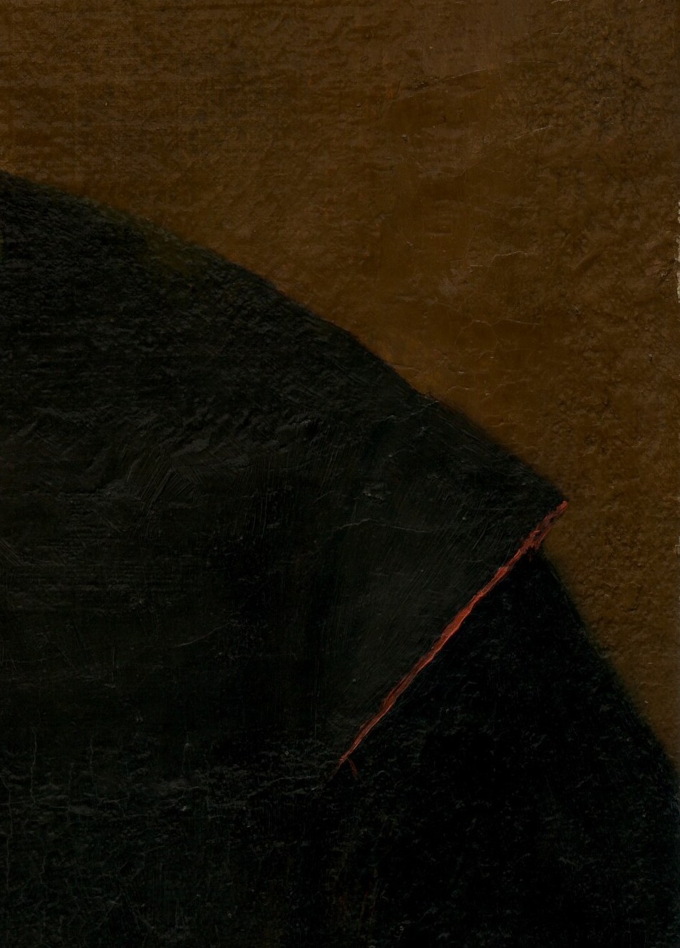 His right shoulder dissolves completely into the background.