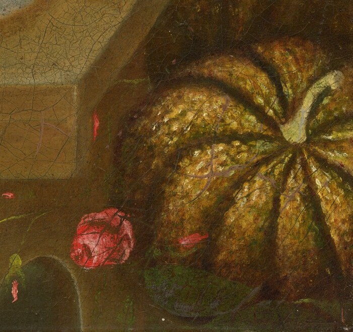 An autumn pumpkin and summer watermelon share the same table.