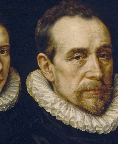 His direct gaze and furrowed brow convey authority and perhaps a hint of weariness.