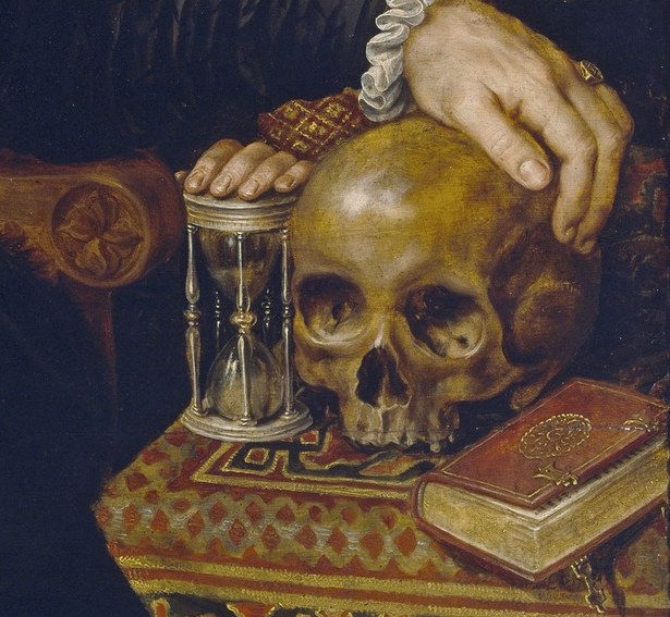This boy holds symbols of life and death.