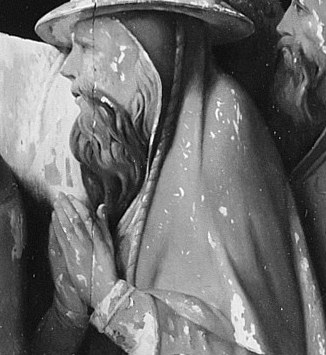 Even the figures in the shadows seem lost in prayer.