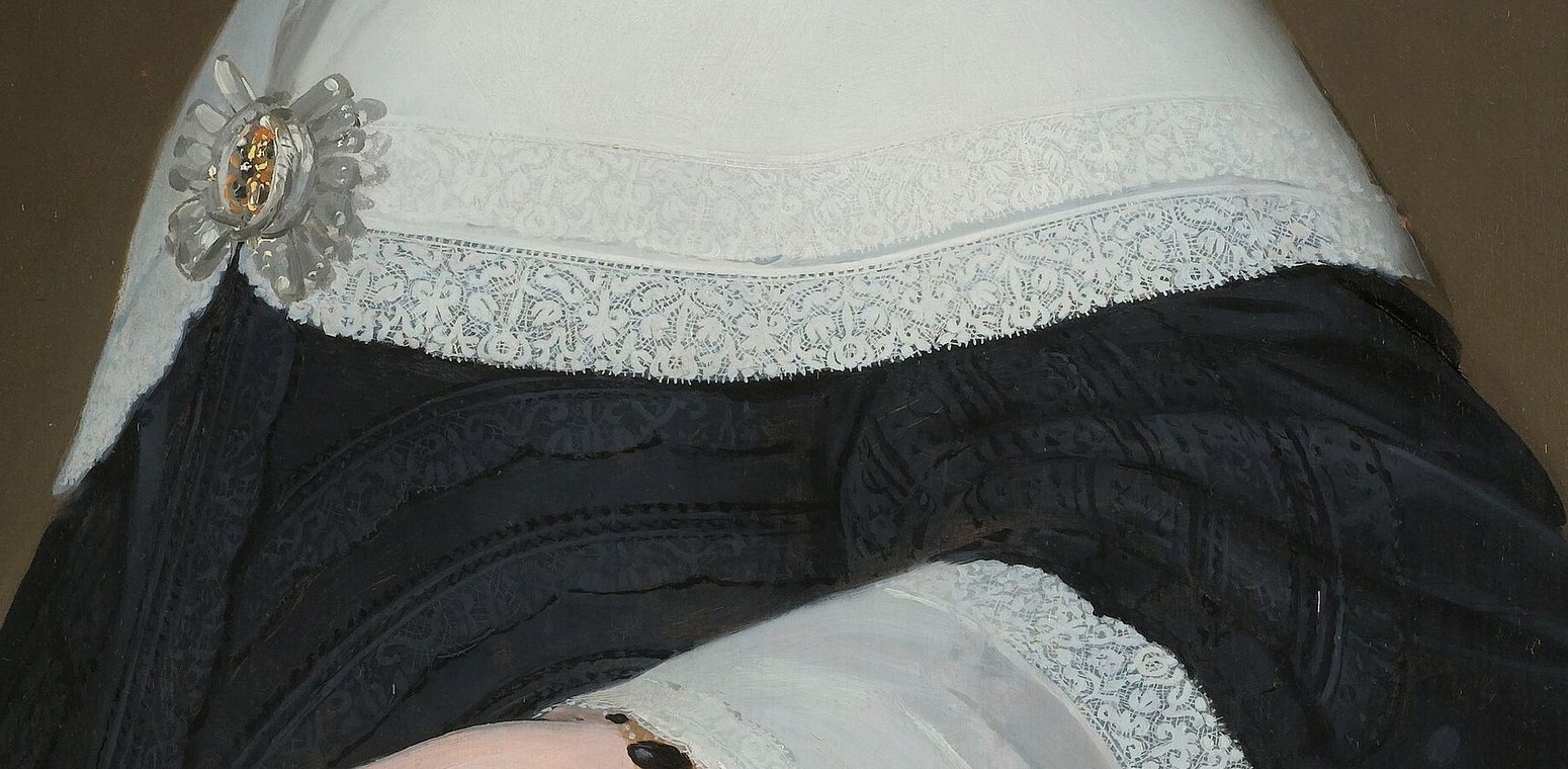 Her lace collar and cuffs show fine detail.