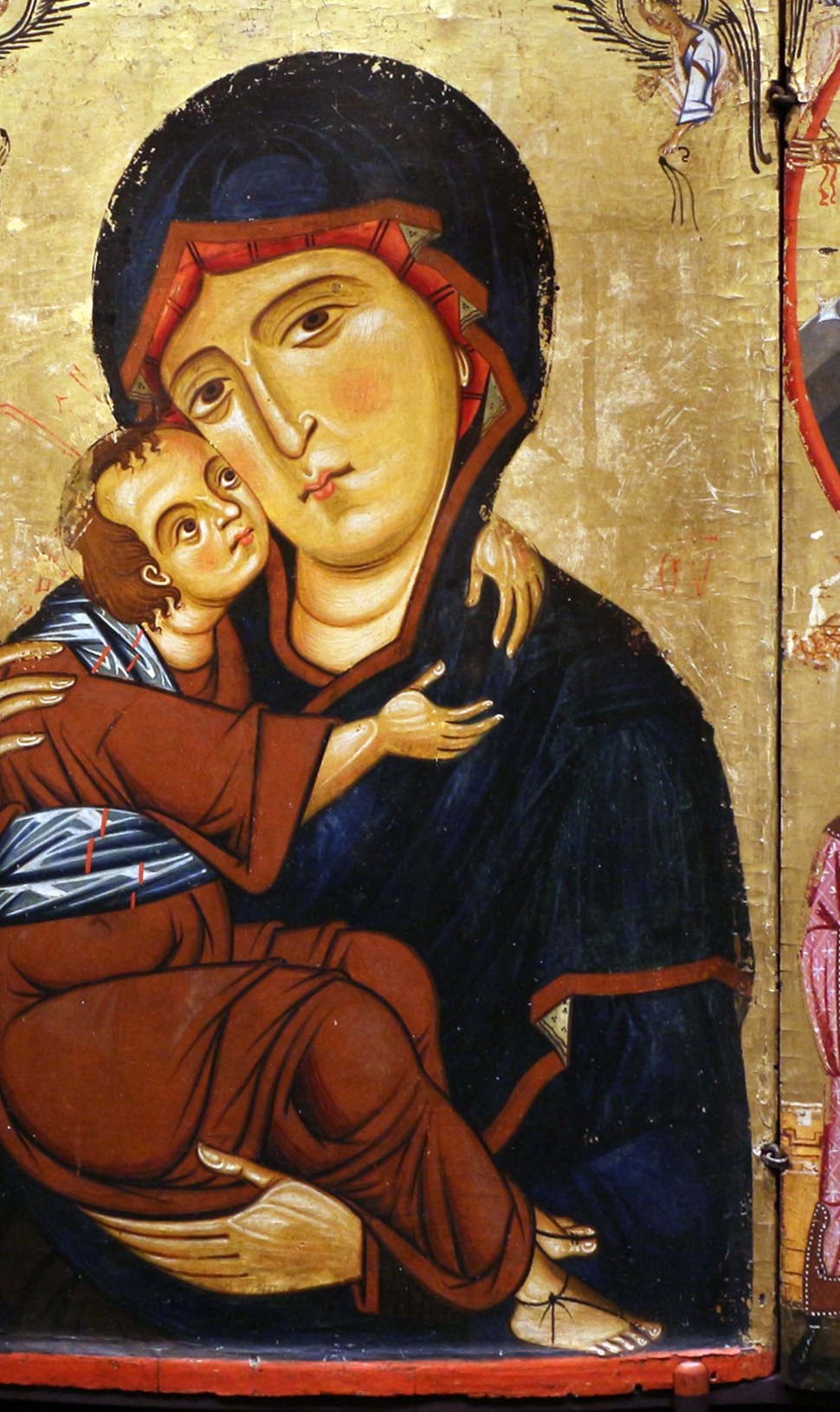 At its heart, the Madonna and Child, tenderly embracing.