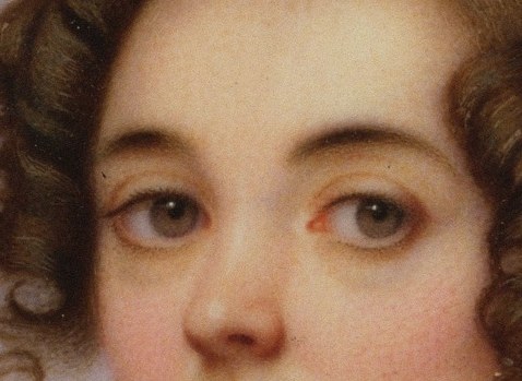 Her direct gaze and composed expression are striking here.