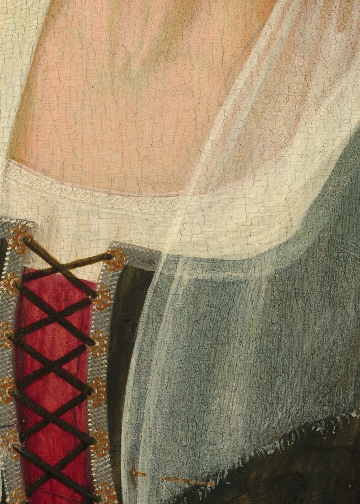 The one pulse of red: a laced bodice. A sign she was still vital.