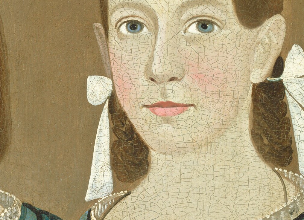 Her slightly more serious expression and direct gaze offer a subtle contrast to her sister.