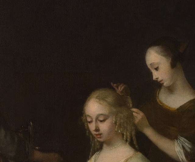 Her downcast gaze and composed expression are the emotional fulcrum , the viewer reads the letter's power entirely through her controlled reaction.