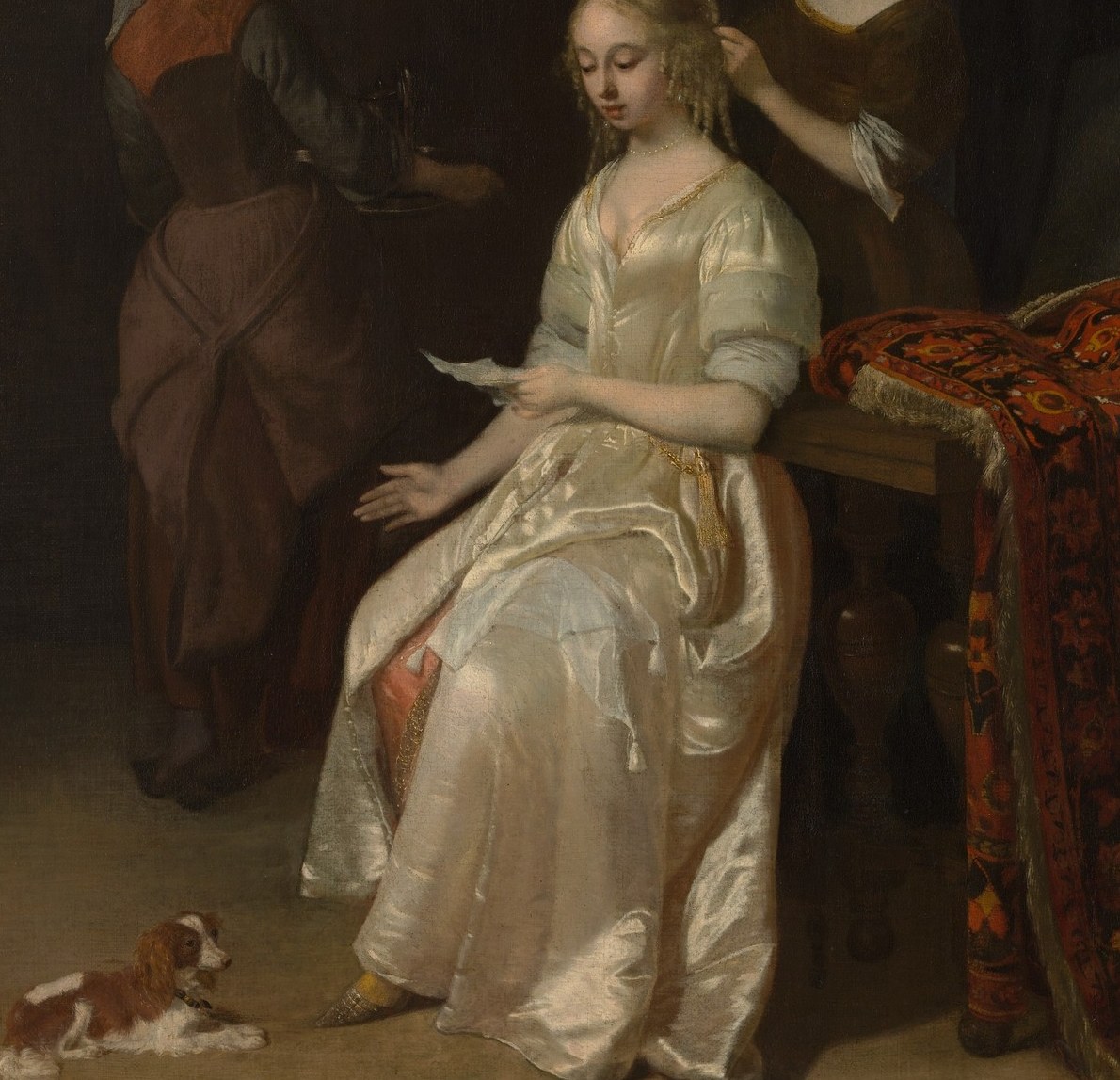 Ochtervelt's signature virtuoso passage: the interplay of cool highlight and warm shadow across silk satin is the technical showpiece that places him alongside ter Borch.