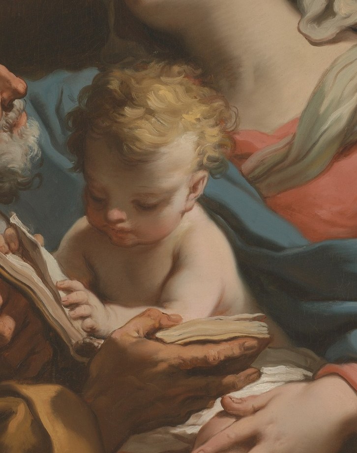 Mary in blue. Joseph with his book. The child reaching for it.