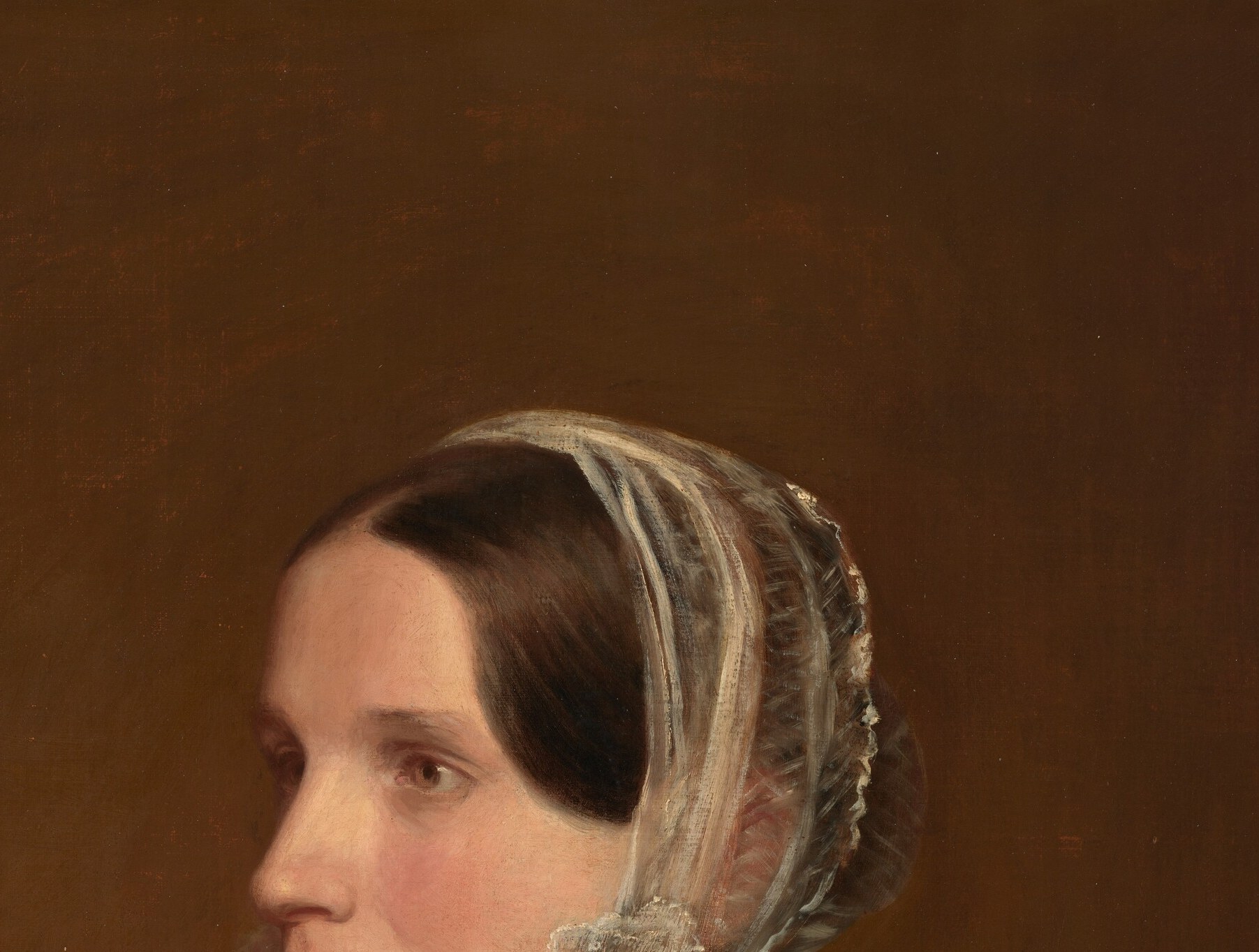 Delicately rendered translucent lace against dark hair , a virtuoso passage of fabric texture that tests any painter's technique.