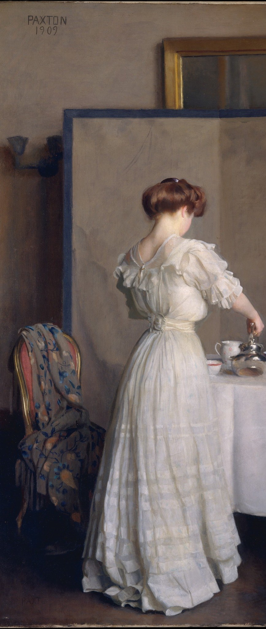 The hostess in white is mid-pour.